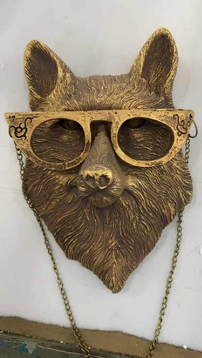 Antique bronze animal pendant showing bear design with synthetic resin construction