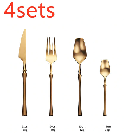 Four-piece stainless steel cutlery set showing main knife, fork, spoon, and teaspoon with mirror finish
