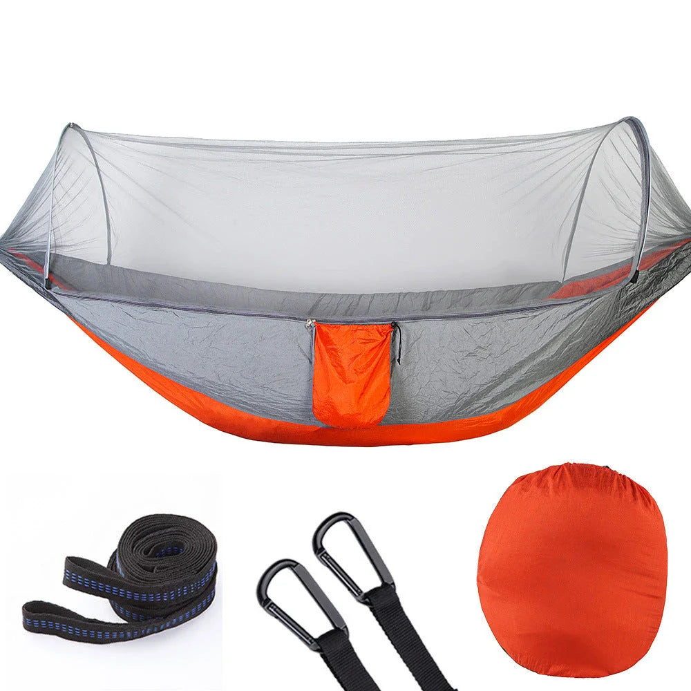 Cozy outdoor hammock with mosquito net for relaxing in nature and outdoor adventures