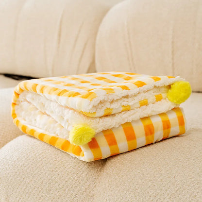 Blue coral fleece pet blanket shown in a Large size (70x50cm) on a wooden floor.