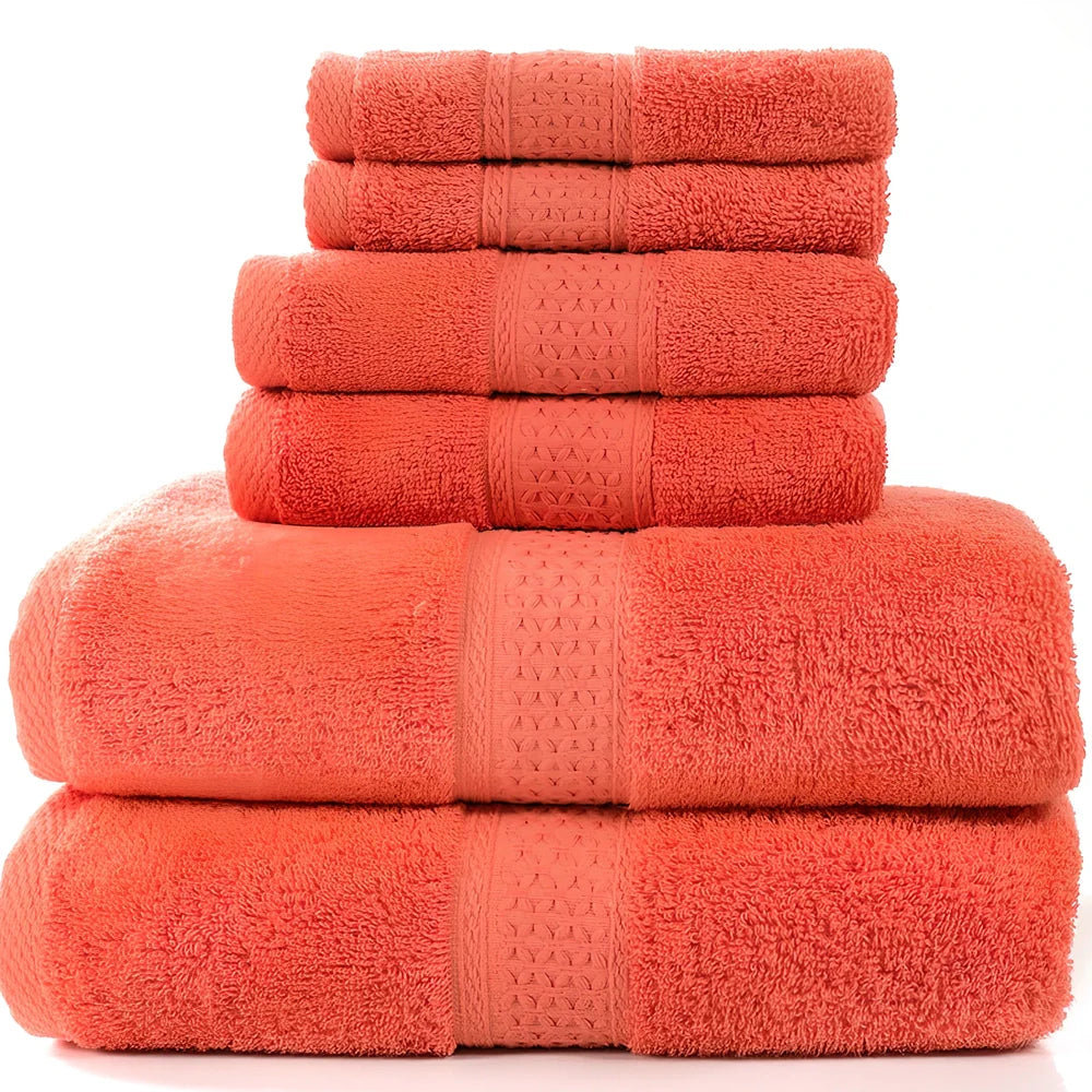 Cotton towel set showing bath towel, hand towel, and face cloth in coordinated sizes