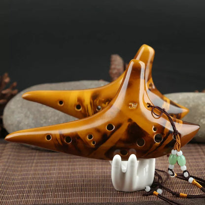 Ceramic 12-hole smoldering ocarina in alto C pitch with nest-inspired design
