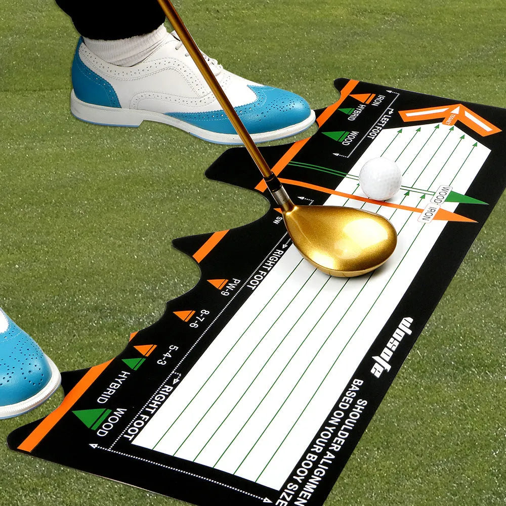 Black neoprene golf swing posture pad with directional markings on a green surface.