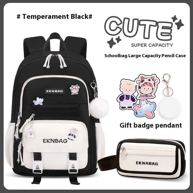 Pink waterproof Oxford cloth school backpack for girls with curved shoulder straps, shown with matching pencil case.