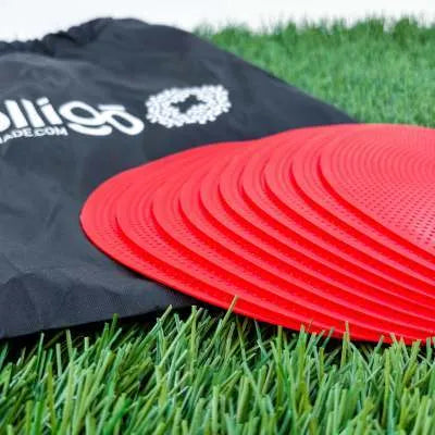 Soft yellow TPE football landmark pad disc on grass, 23 cm diameter.
