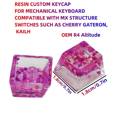 A transparent resin keycap with a starry sky design inside, shown in a green colour variant.