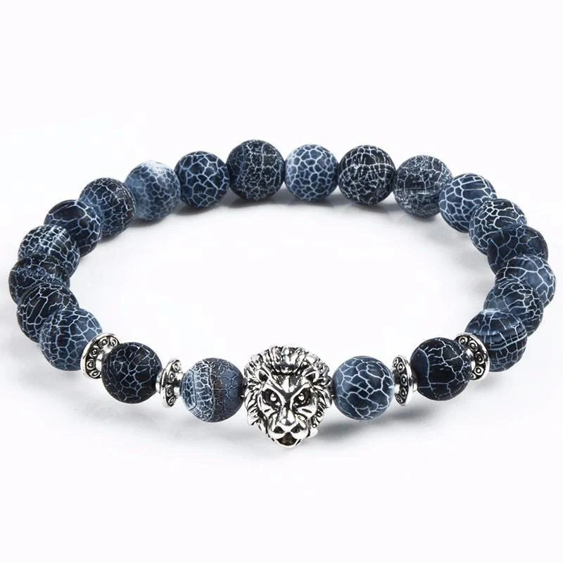 Carved stone bracelet featuring a powerful lion design, meant to enhance confidence and style.