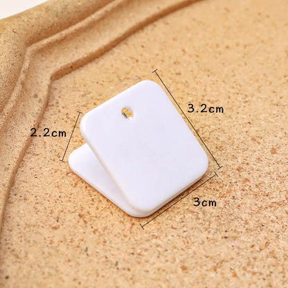 Square plastic photo holder in black, white, and transparent colour options on desk