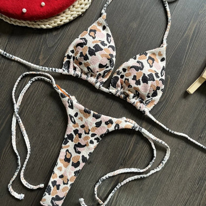 Women's printed bikini swimsuit with briefs style and cotton lining on a mannequin.