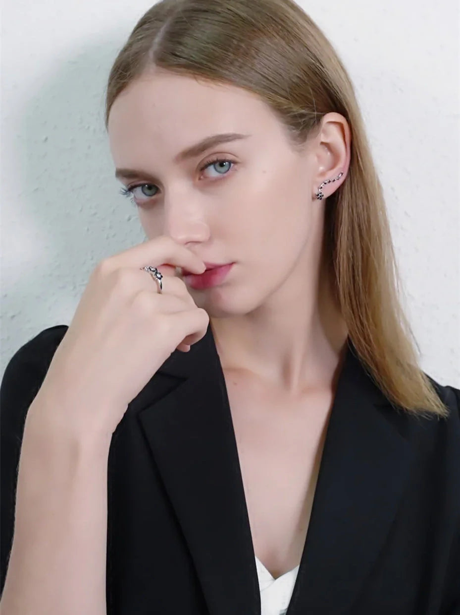 Women's long fringed zircon earrings in black with flower details and secure backing