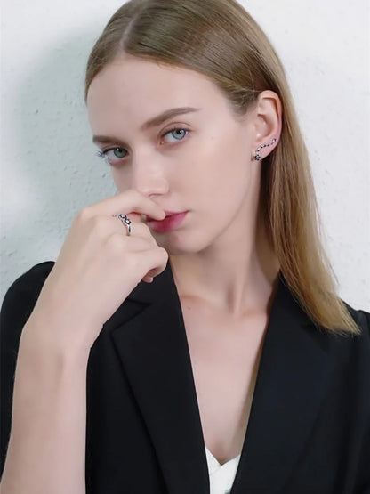 Women's long fringed zircon earrings in black with flower details and secure backing