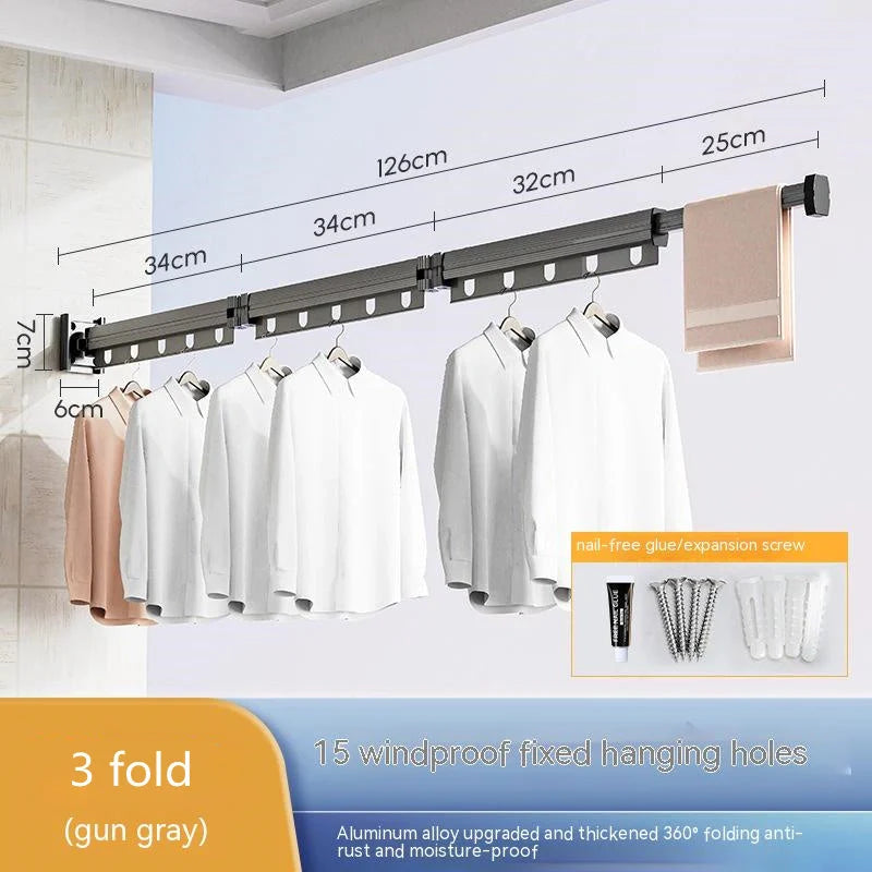 Aluminum retractable drying rack mounted on a window, extending outward for clothes drying