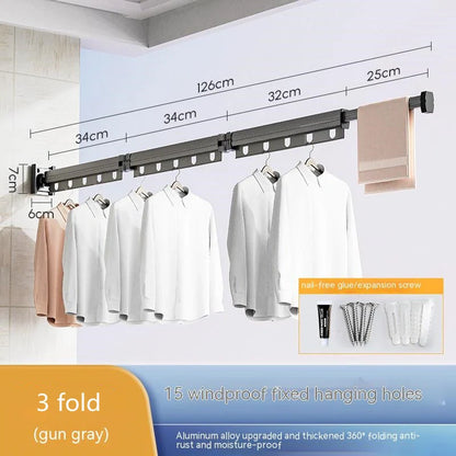 Aluminum retractable drying rack mounted on a window, extending outward for clothes drying