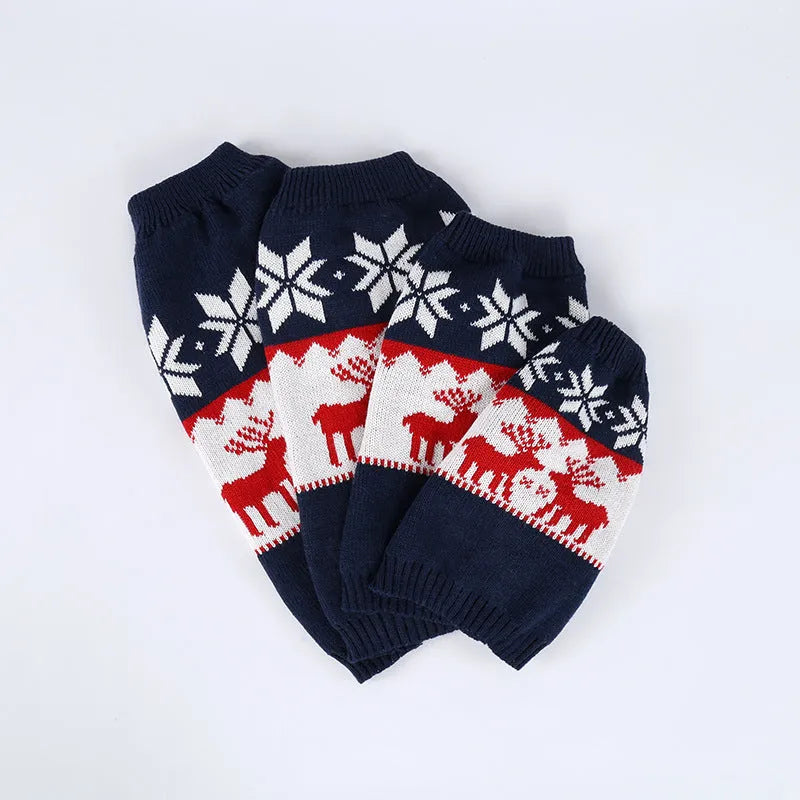 Navy blue knitted Christmas sweater for dogs on a festive background