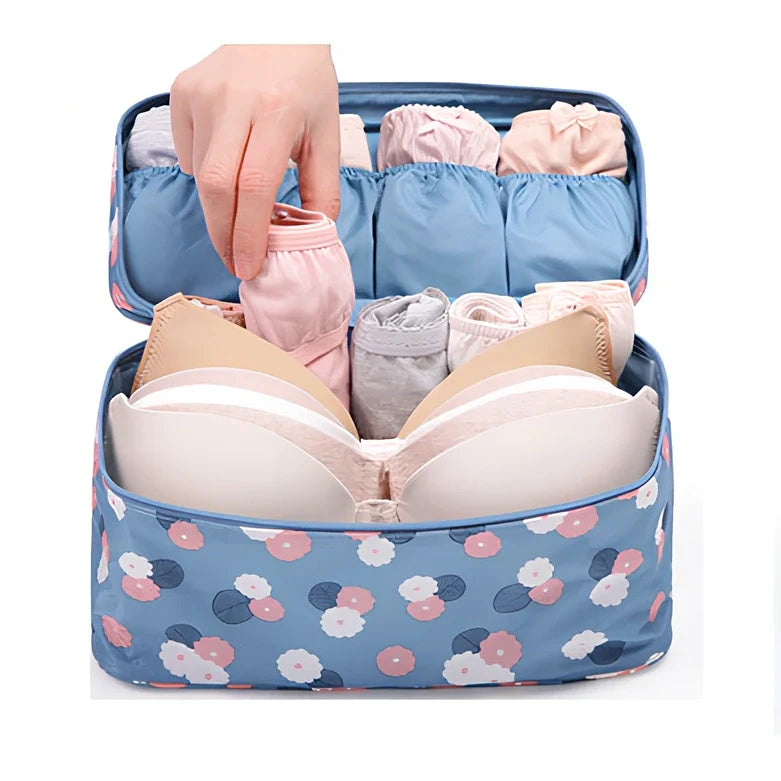 Compact travel underwear organizer in navy blue, 28cm x 14cm x 14.5cm with mesh pockets for packing