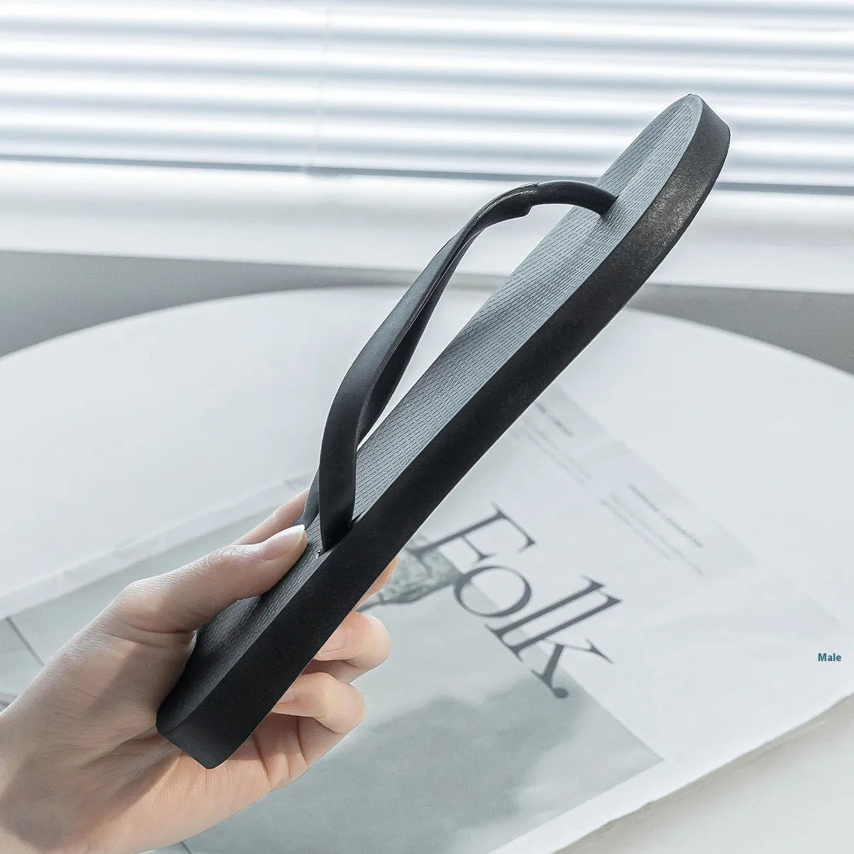 Foldable casual slippers with hollow-out plastic upper and non-slip PVC soles in black colour