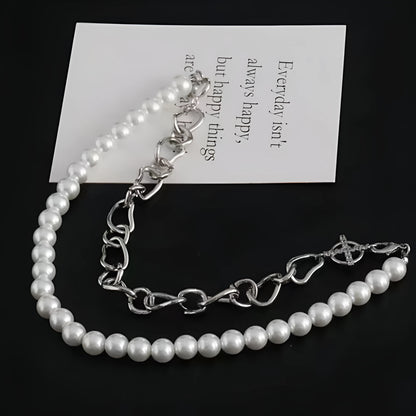 White geometric acrylic asymmetric clavicle chain necklace on a twisted chain.