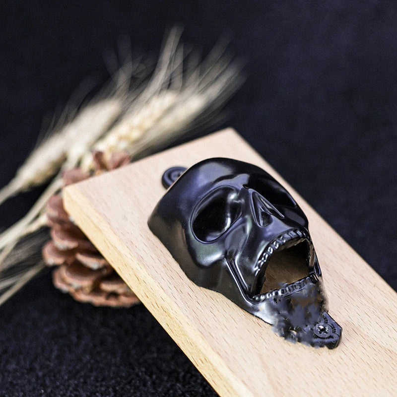 Stylish skeleton-shaped magnetic bottle opener with sleek black finish and solid wood base