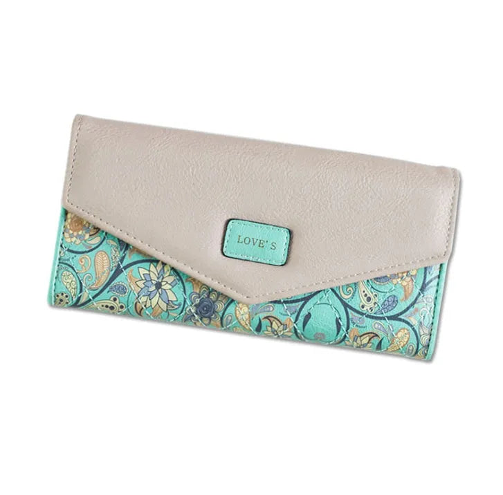 Three-fold leather wallet with buckle closure showing black colour variant, note clip visible inside compartment