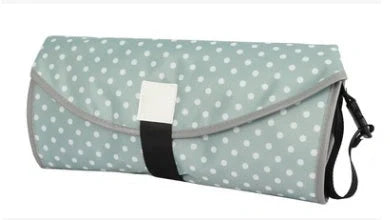 Portable and Waterproof Baby Changing Pad in various color designs, featuring a compact folded size and generous expanded size for comfortable diaper changes