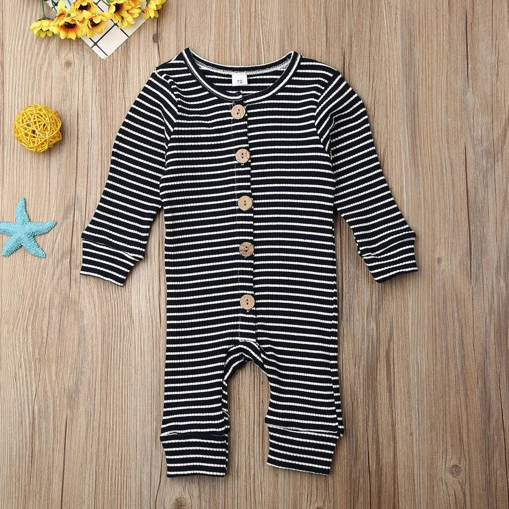 Newborn wearing a striped knitted jumpsuit in cotton, sizes 70-100cm, available in six colours