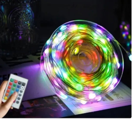 Multi-colour LED animated outdoor Christmas tree lights showing garden installation with 1.5m and 2m size options