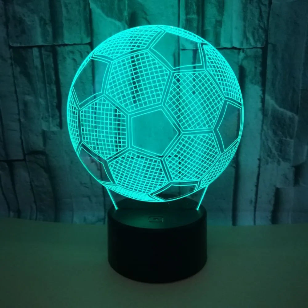 3D football-shaped LED night light showing colourful gradient illumination on a dark background