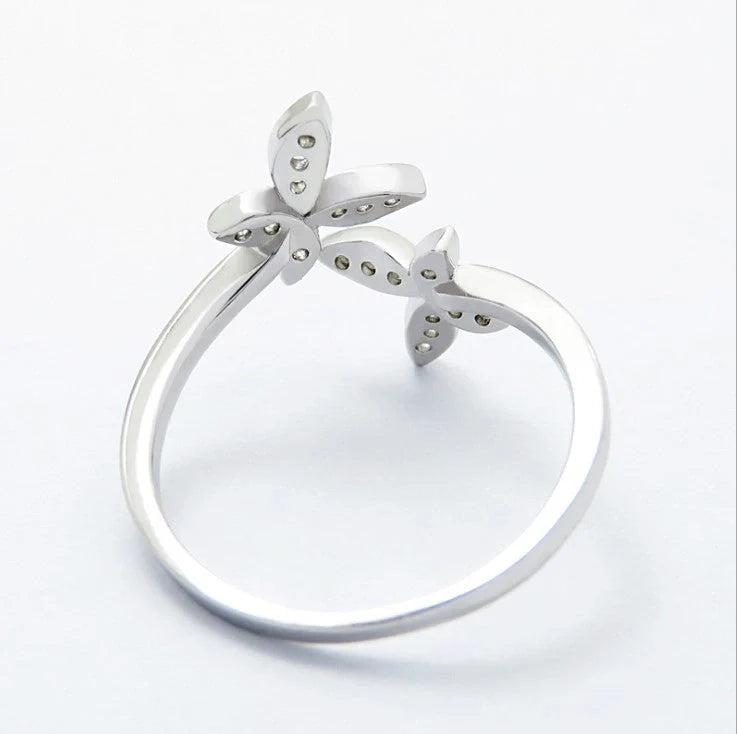 Adjustable sterling silver ring with intricate butterfly design, ideal for everyday wear or special occasions.