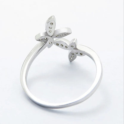 Adjustable sterling silver ring with intricate butterfly design, ideal for everyday wear or special occasions.