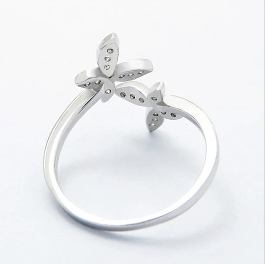 Adjustable sterling silver ring with intricate butterfly design, ideal for everyday wear or special occasions.