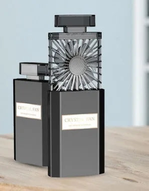 Pink coloured personal perfume fan with USB charging port for aroma diffusion.