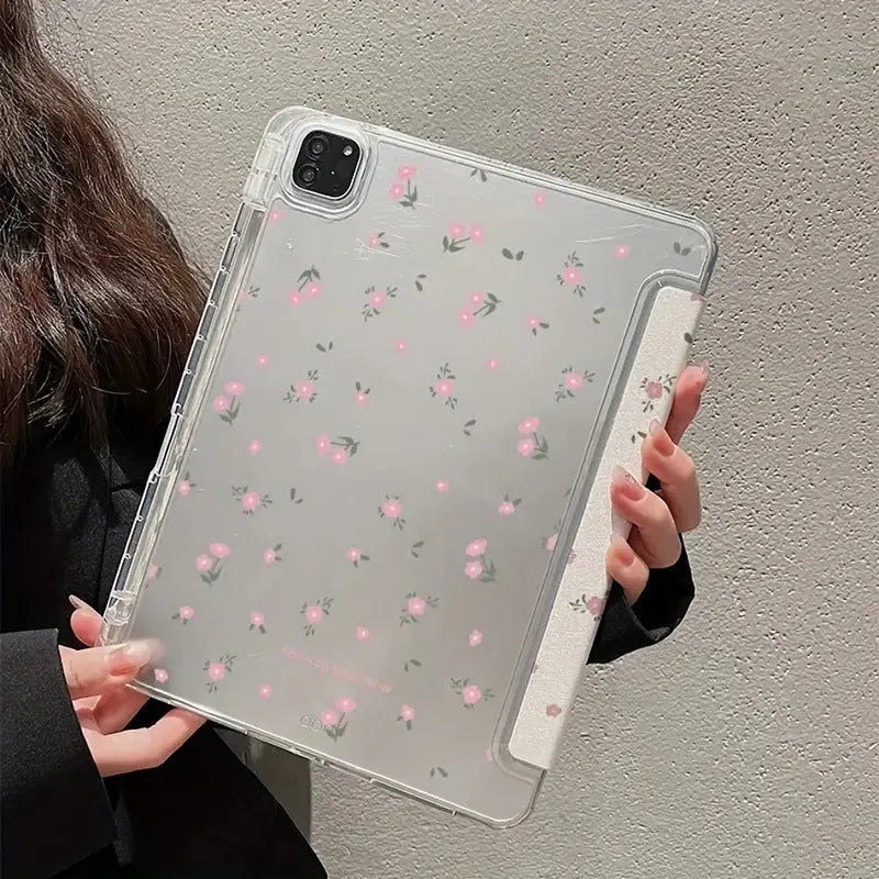 Transparent floral design tri-fold iPad case with magnetic stand open, showing tablet screen.