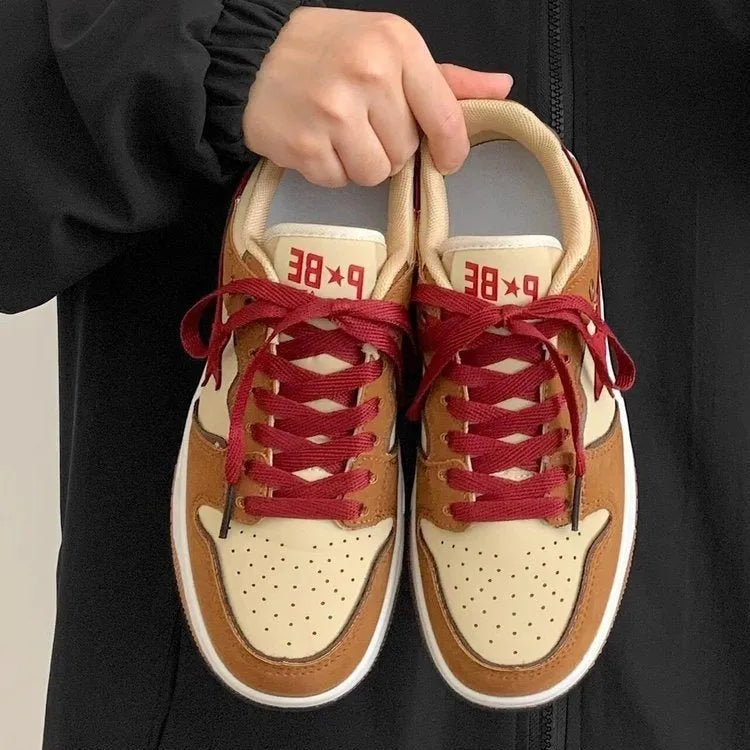 Brown women's platform sneakers with sequin trim and lace-up front