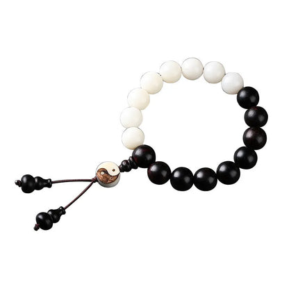 Handmade bodhi seed bracelet with eight-diagram pattern in white and blackwood beads