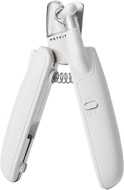 White pet nail clippers with LED light, anti-splash guard, and built-in nail file on a flat surface.