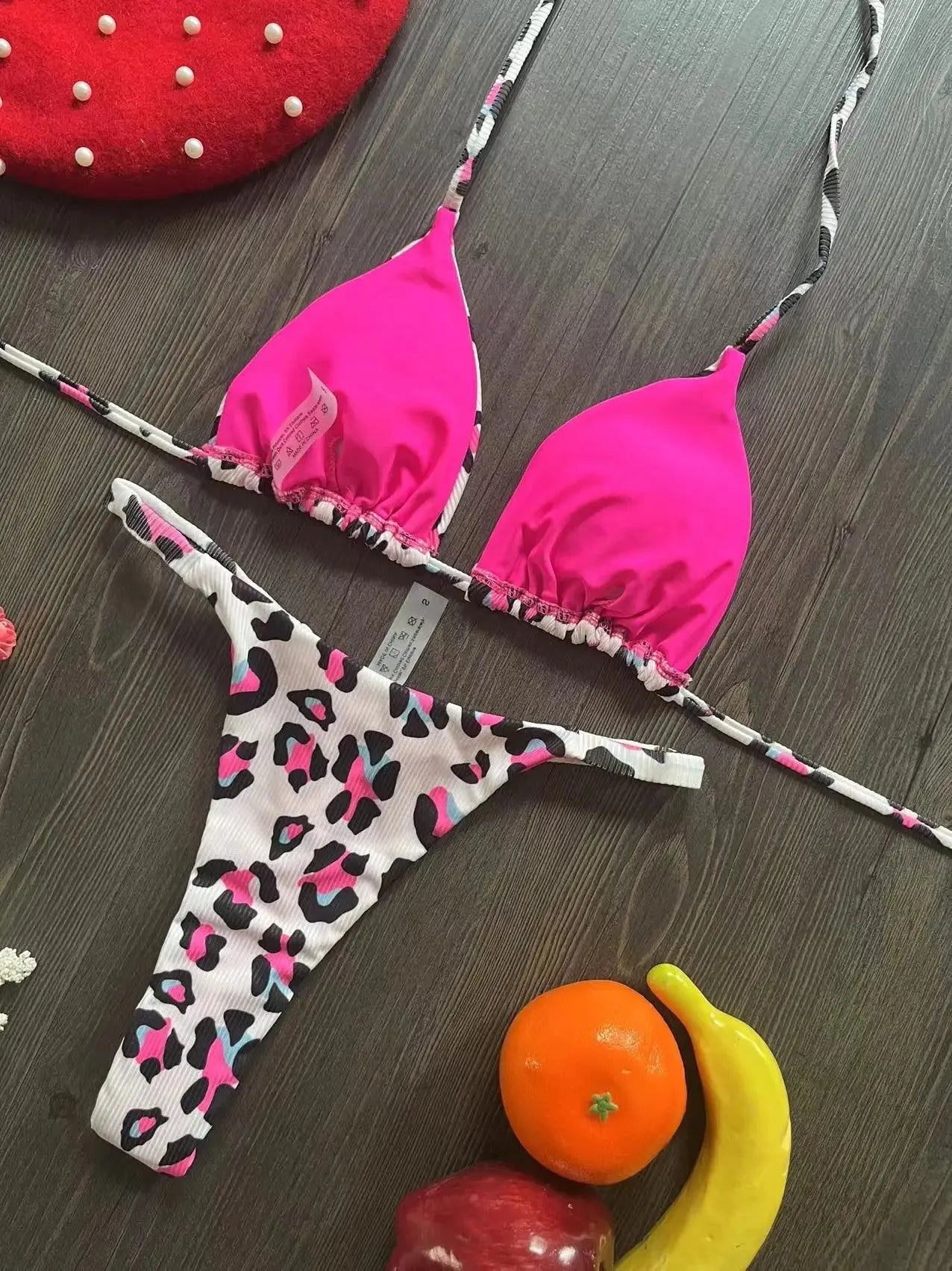 Women's printed bikini swimsuit with briefs style and cotton lining on a mannequin.