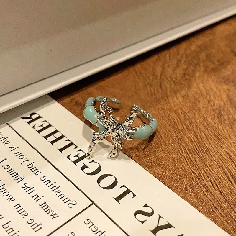 Copper women's ring with Chinese butterfly design and adjustable open loop.