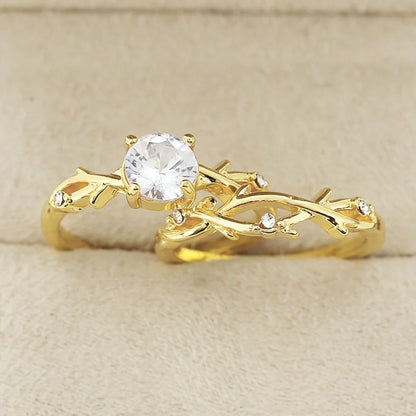 Geometric design rose gold plated couple rings with simulation diamond centrepiece showing faceted edges