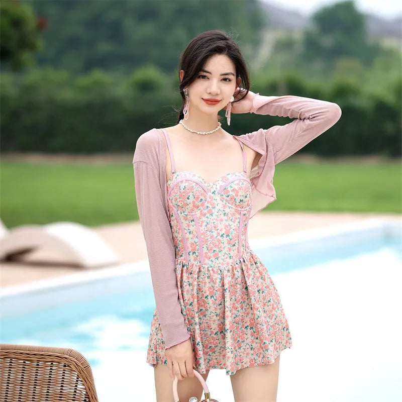 Women's floral jumpsuit swimsuit with adjustable suspender straps in pink or green colour options