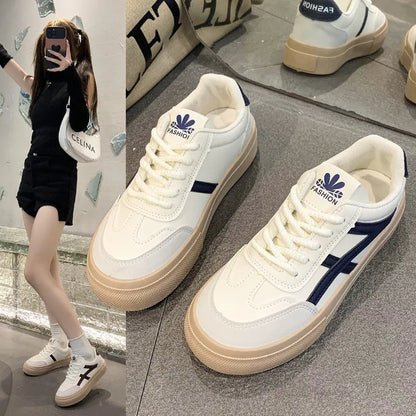 Blue and brown low-top casual sports shoes with round toe and flat rubber sole.