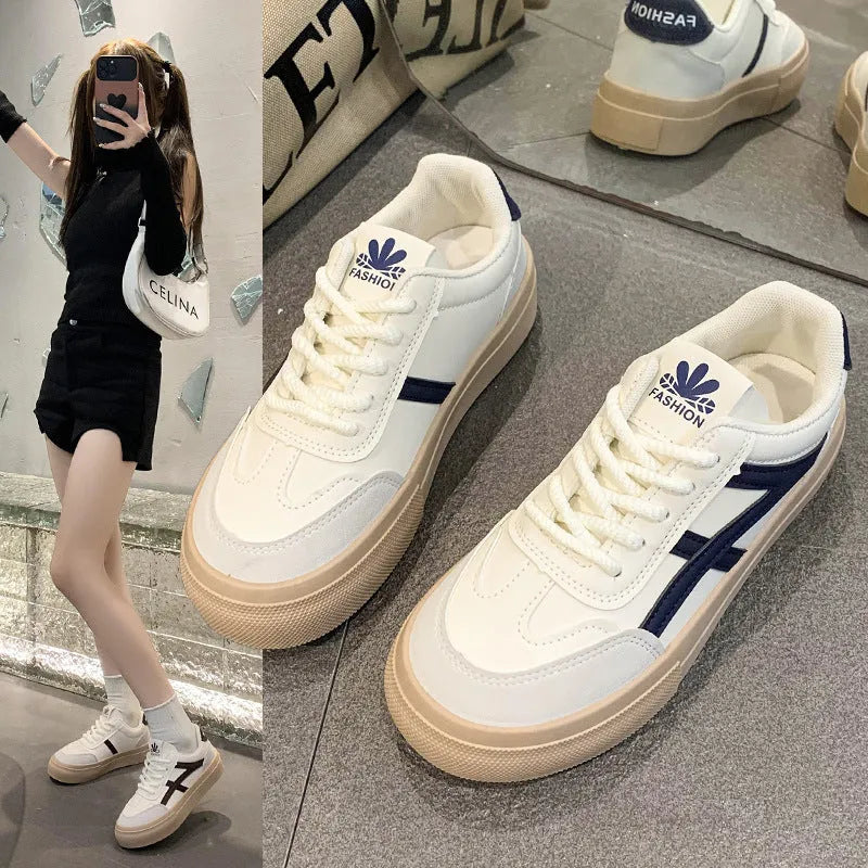 Low-top casual sports shoes in blue or brown colour with round toe, flat rubber sole, lace-up front and injection moulded construction for versatile everyday wear.