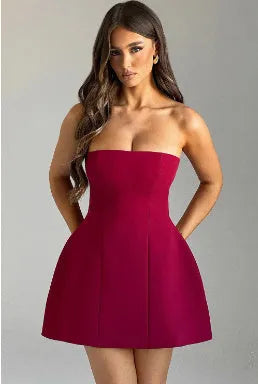 Backless women's tube dress in solid colour with high waist and A-line short skirt.