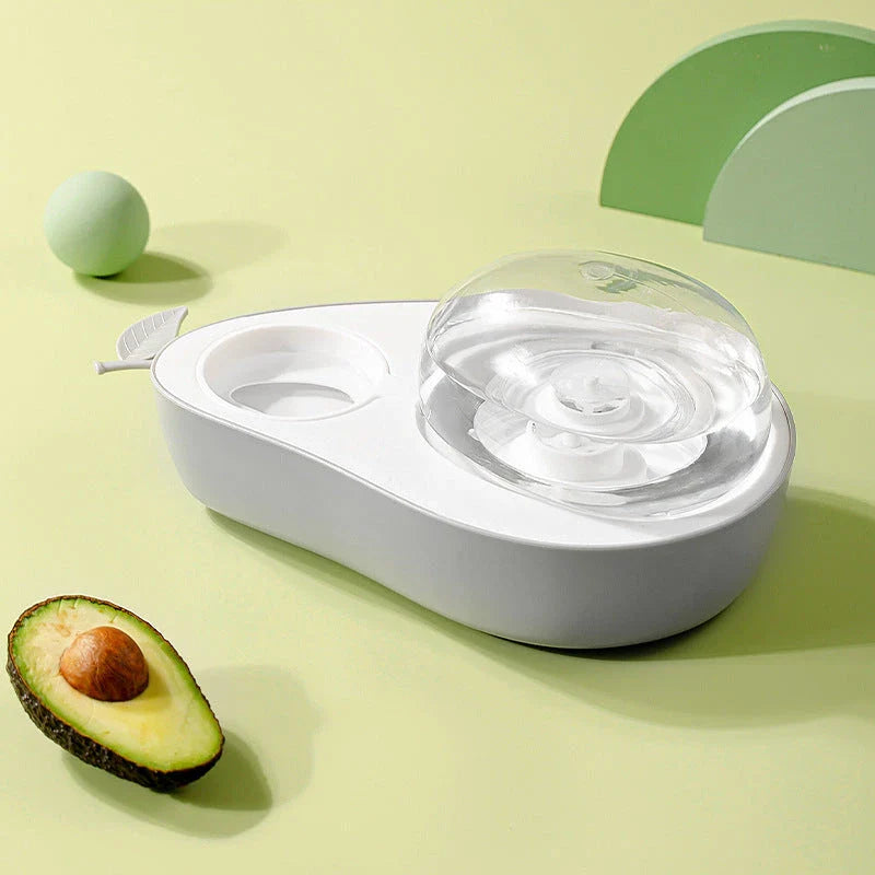 Avocado-shaped automatic pet feeder and water dispenser for dogs and cats, featuring slow-feed bowl, adjustable water flow, and durable construction