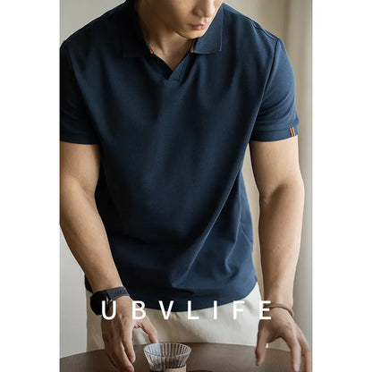 Light blue cotton polyester short-sleeved polo shirt on a hanger.