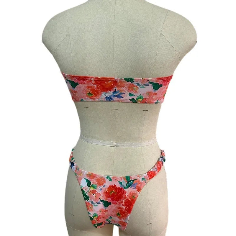 Colourful floral print tube top bikini set with lace trim on a mannequin
