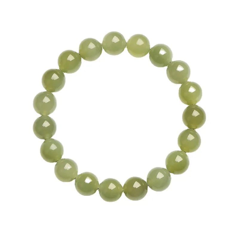 Hetian jade ball bracelet with polished spherical beads in ice-like clear water colours on wrist