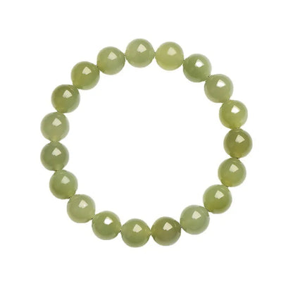 Hetian jade ball bracelet with polished spherical beads in ice-like clear water colours on wrist