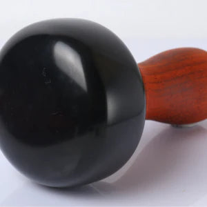 Bian Stone Warming Moxibustion Apparatus with red rosewood construction and natural bian stone for targeted heat therapy and traditional Chinese healing