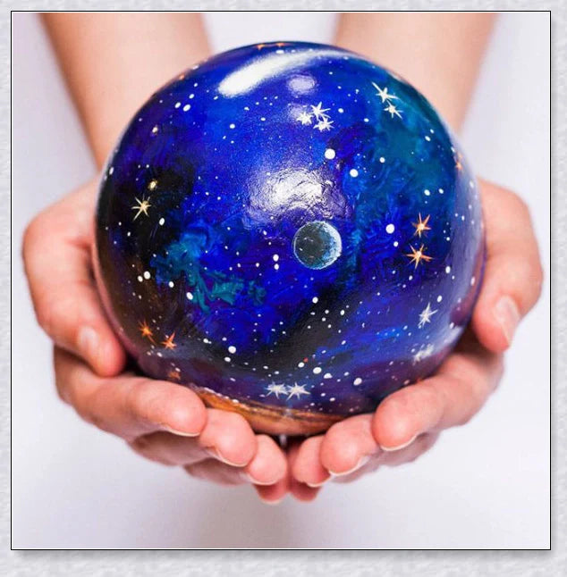 Detailed wooden solar system model with hand-painted planets, astronaut figure, and rocket for interactive space learning and exploration.