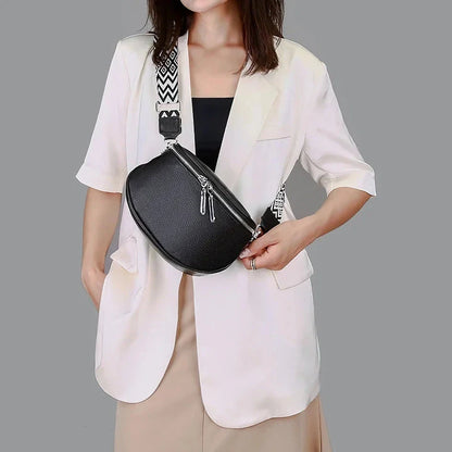 High-quality genuine leather tote bag for women, featuring a beige body with a colorful strap, multiple interior compartments, and a sleek, elegant design.